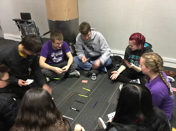 The Students playing a round of spoons with highlighters!